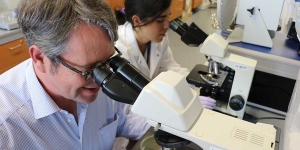 people at microscopes